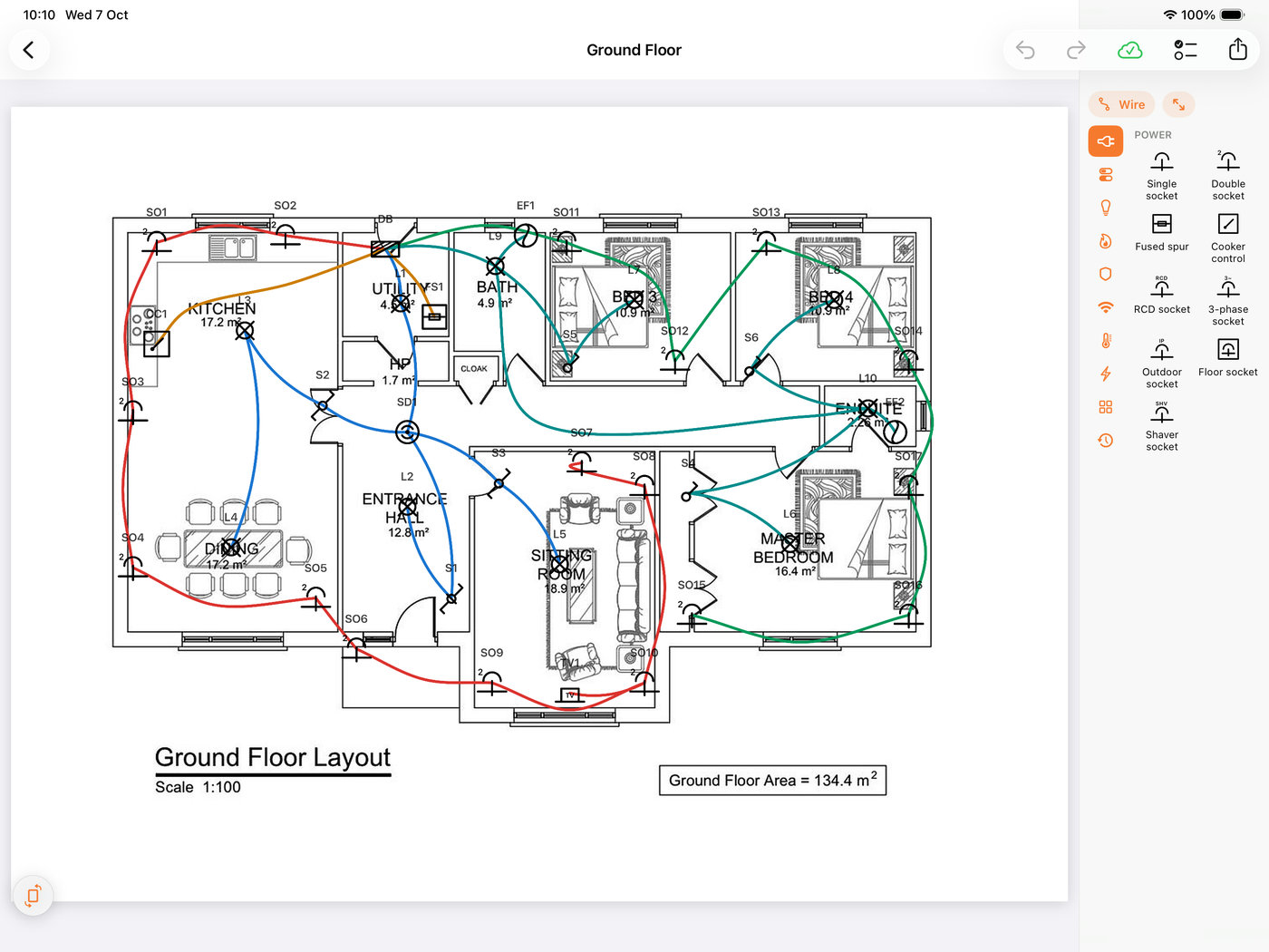The editor on an iPad: the scanned floorplan in, the symbol panel beside it